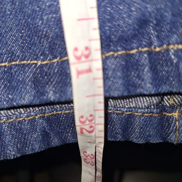 A Roaman's Denim Blue Midi Skirt in a size 26W. Pre-loved in great condition