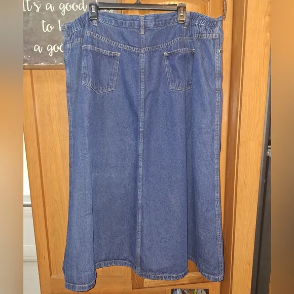 A Roaman's Denim Blue Midi Skirt in a size 26W. Pre-loved in great condition